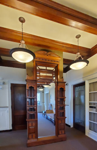 Lyman Mansion - Beautiful wood mirror, lighting and ceiling in foyer